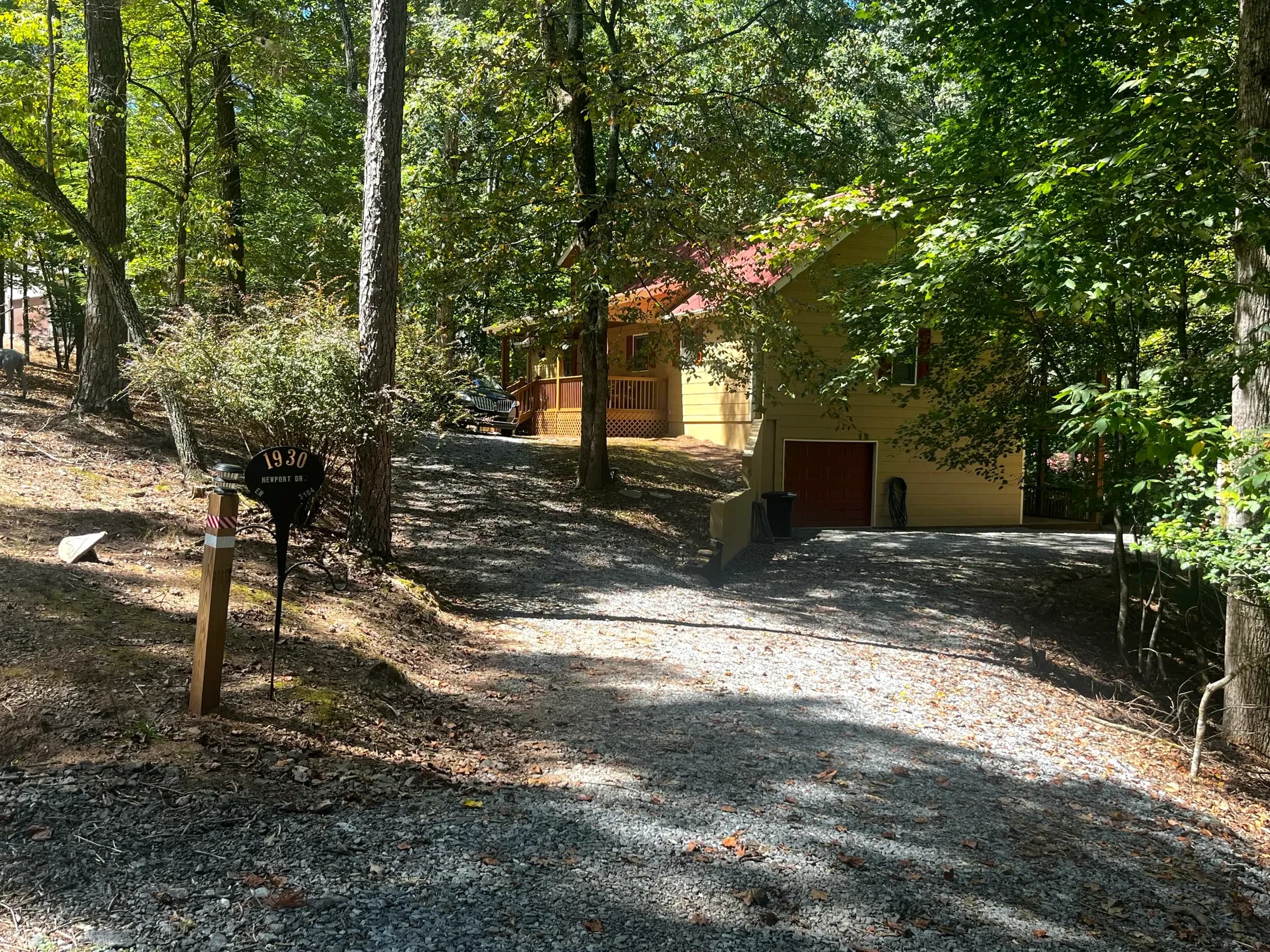 Private gravel driveway and address sign at Taste and See Oasis