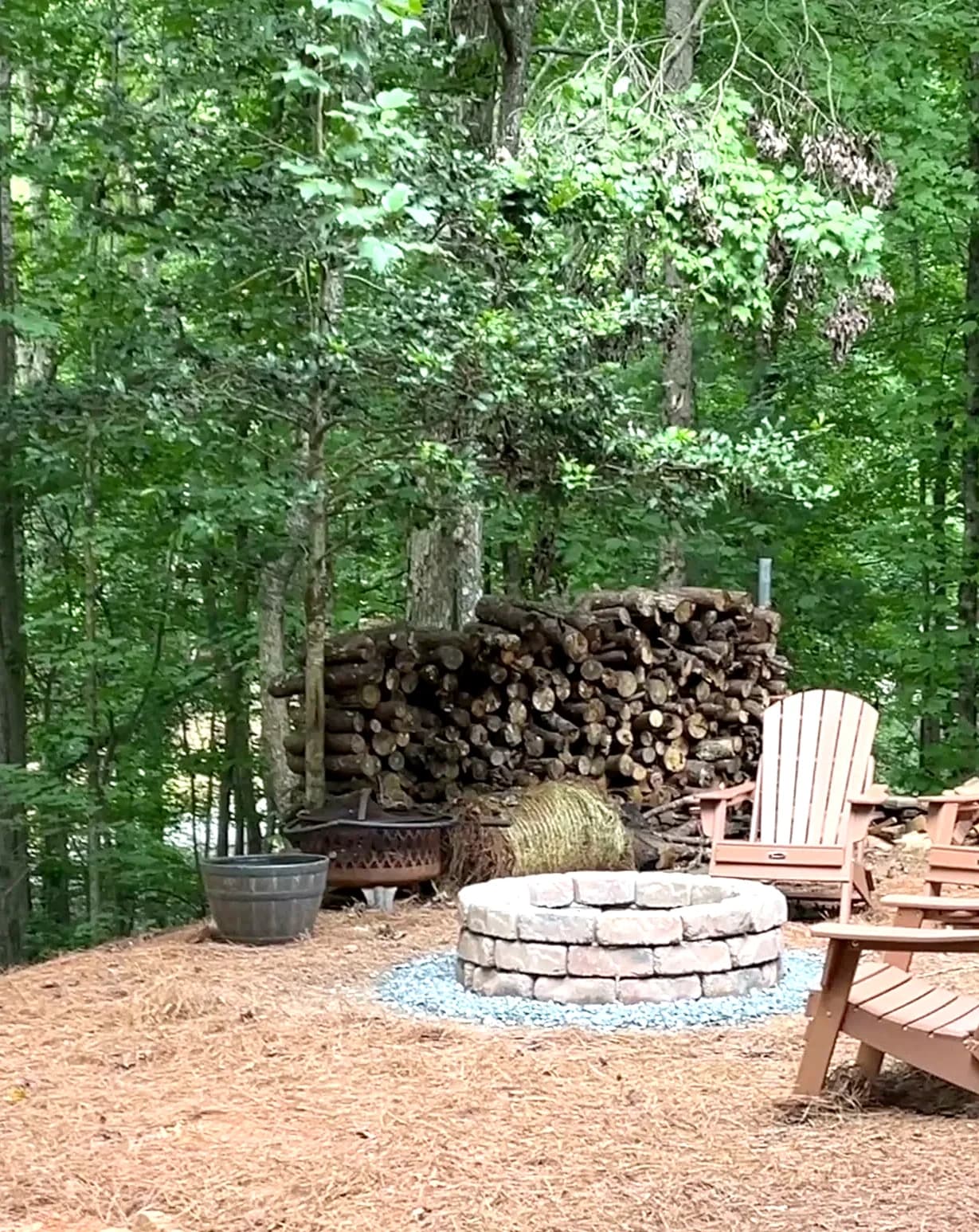 Stone fire pit seen from the private deck